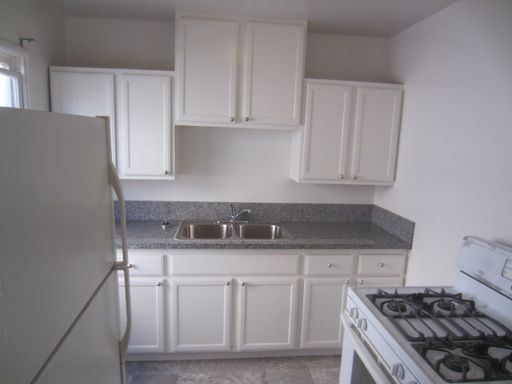 Upper unit w/REMODELED KITCHEN, PLANK FLOORS & Onsite Laundry - GARAGE AVAILABLE – photo 1