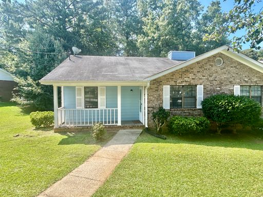 Charming 2-bedroom, 1.5-bath home in Jonesboro, GA featuring a cozy fireplace and a well-equipped kitchen with ample cabinet storage. – photo 1