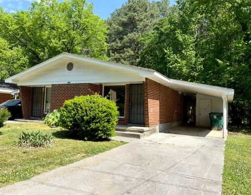 Centrally Located Brick 2 Bedroom Duplex with Carport – photo 1