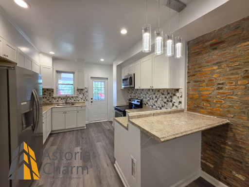 3 Bedroom End Unit with Finished Basement and Fenced Yard on E 28th Street – photo 1