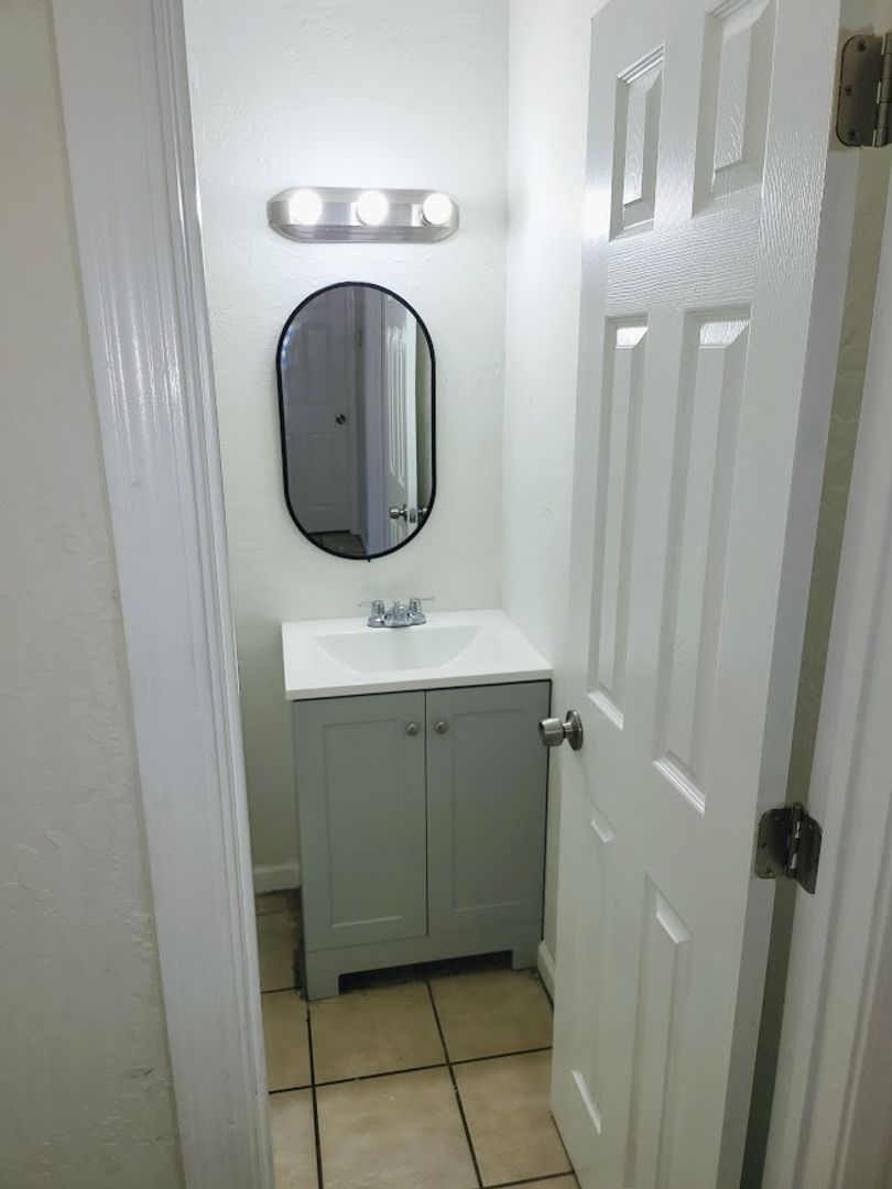 Apartment bathroom — representative home at 814 East Siesta Drive.