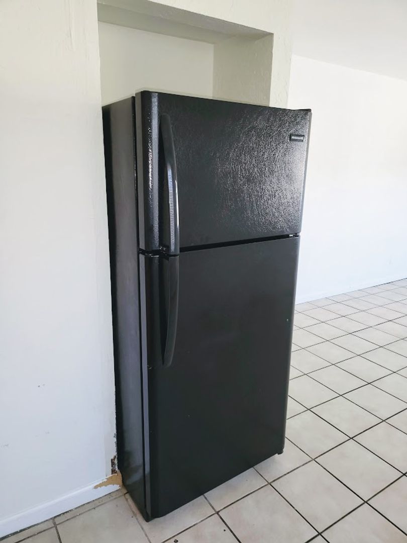 Refrigerator in apartment 03 at 814 East Siesta Drive.