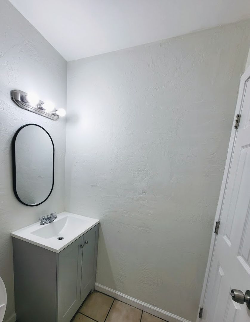 Apartment bathroom — representative home at 814 East Siesta Drive.