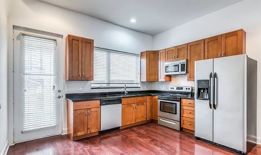 Welcome home to 1456 E Columbia Avenue, a modern three-story townhome offering exceptional space and style in the heart of Fishtown. – photo 1