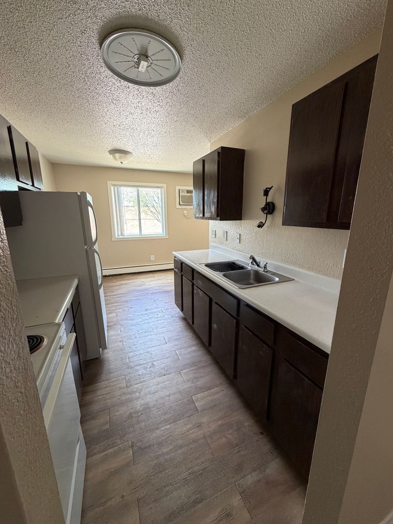 Williston Apartment: 1010, 1016, and 1020 9th Avenue NW