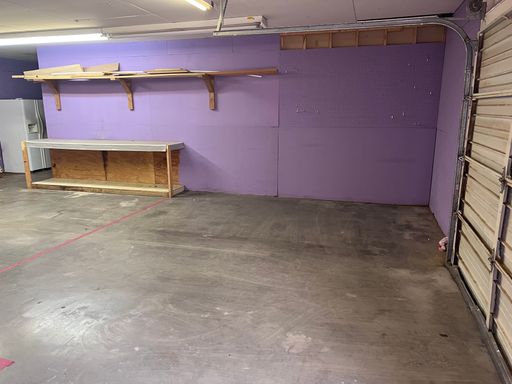large storage with exterior garage door and shower