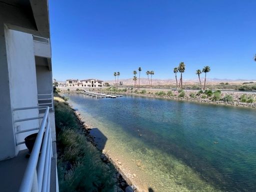 Riverfront 2BR 2BA Furnished Condo on GROUND LEVEL W/Garage and UTILITIES Included AVAIL 4/1/26 – photo 1