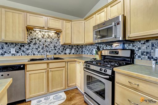 East Anchorage 3 Bedroom Home | Close to JBER! Attached Two Car Garage + Fenced in Yard – photo 1