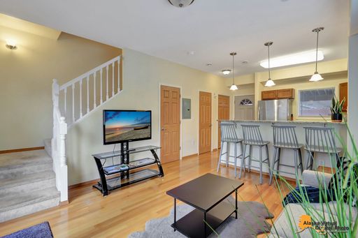 Furnished Townhouse with Rooftop Patio, In Unit Laundry, and Covered Parking – photo 1