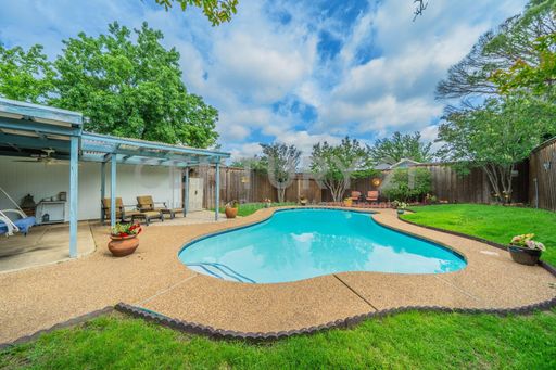 Enjoy Your Own Backyard Oasis in This 3/2/2 Carrollton Home with Sparkling In-Ground Pool! – photo 1