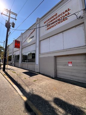 Commercial building with roll up doors for underground parking and storage in Downtown Roseburg – photo 1