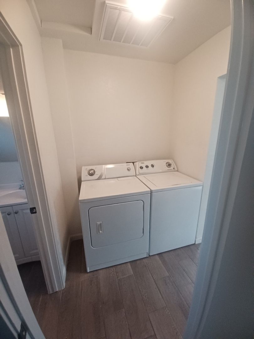 Full-size washer and dryer — apartment 1 at Madison Apartments.
