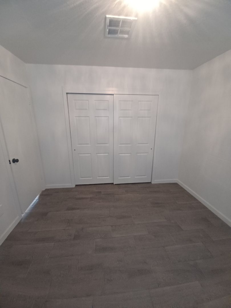 Unfurnished bedroom — apartment 1 at Madison Apartments.