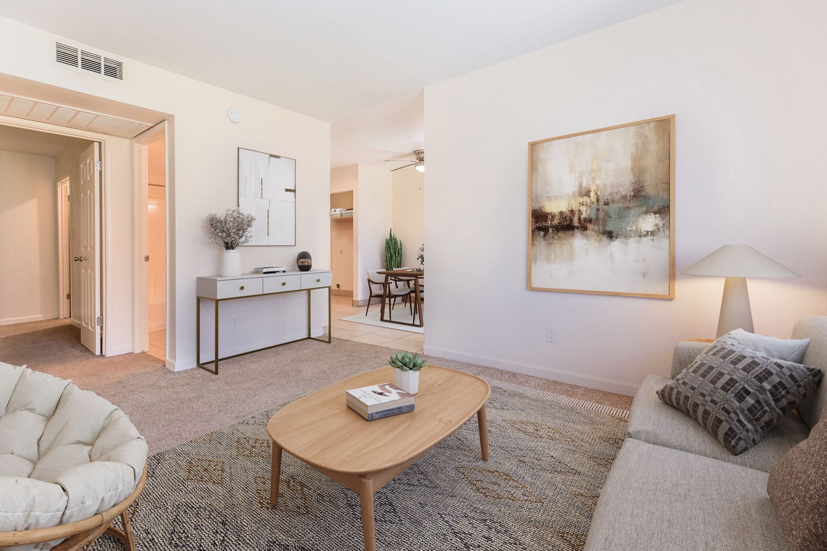 Furnished apartment living area shown — representative home at Lynnwood Apartments.