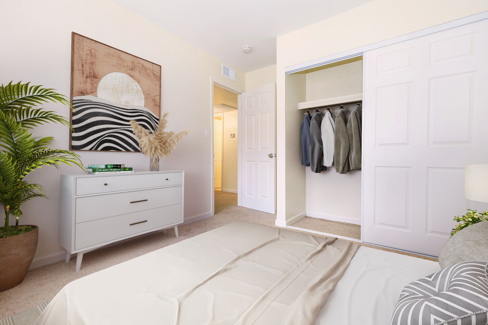 Furnished bedroom shown — representative home at Lynnwood Apartments.