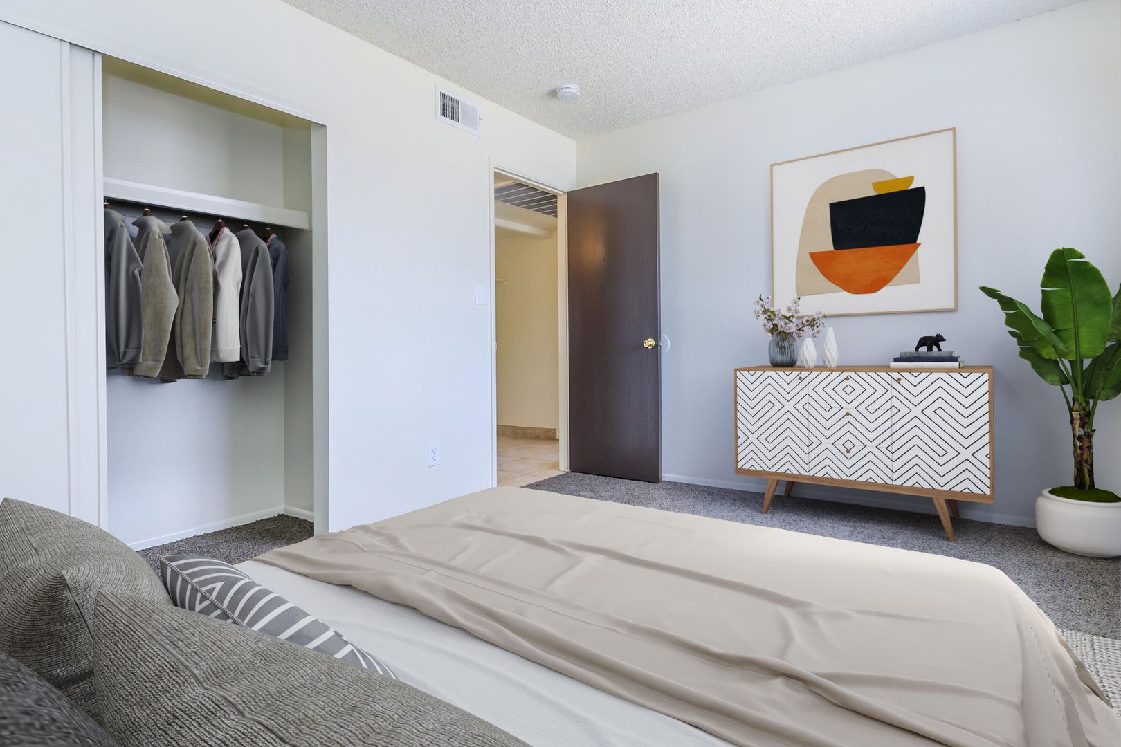 Furnished bedroom shown — representative home at Lynnwood Apartments.