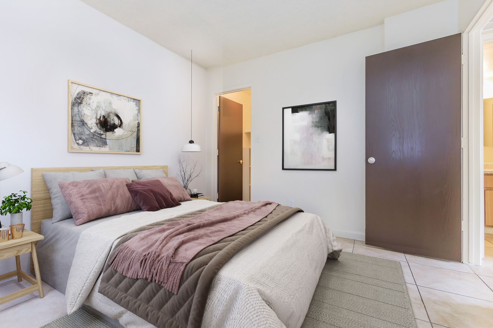 Furnished bedroom shown — representative home at Lynnwood Apartments.