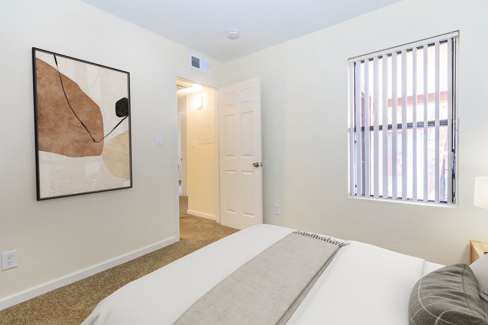 Furnished bedroom shown — representative home at Lynnwood Apartments.