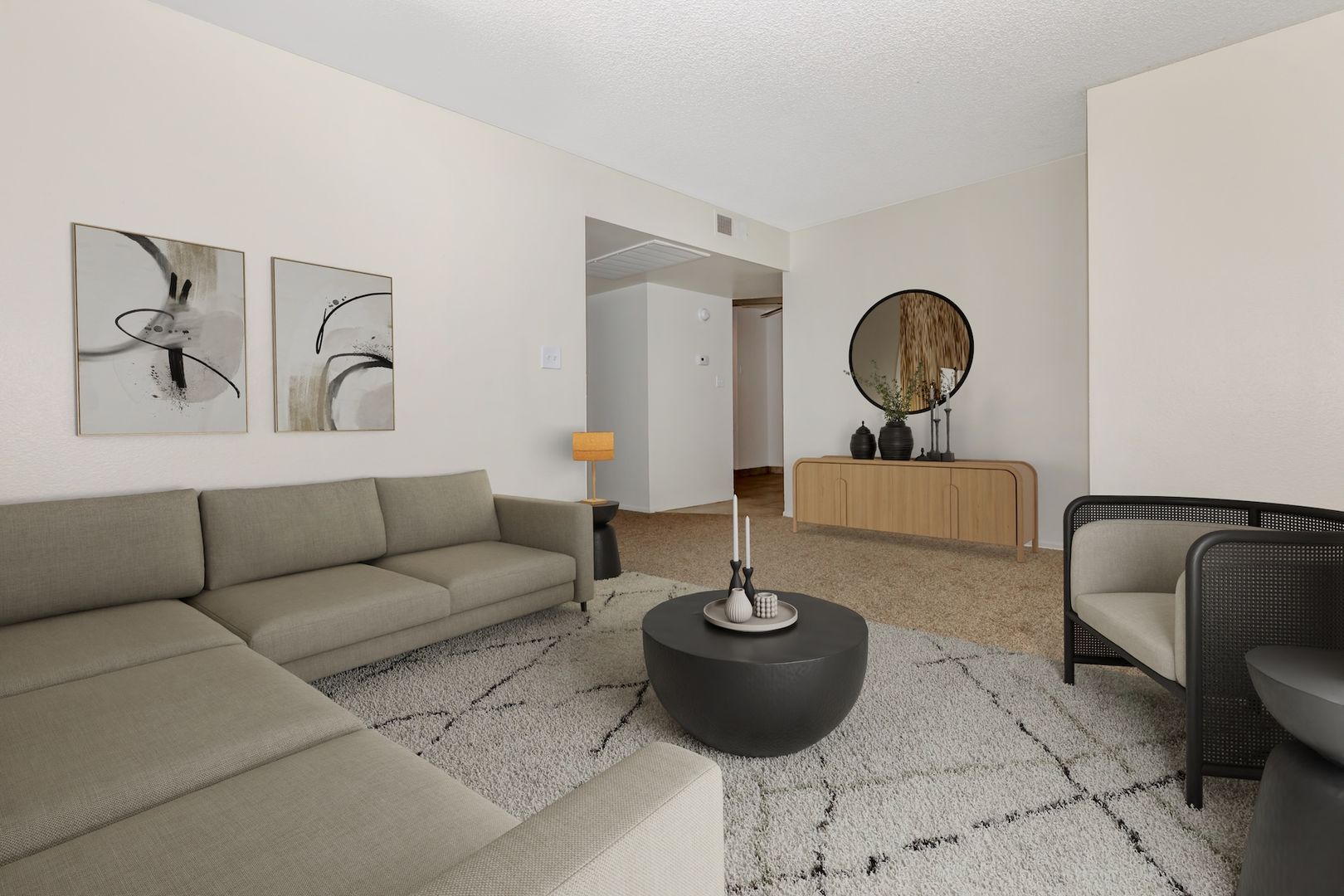 Furnished apartment living area shown — representative home at Lynnwood Apartments.