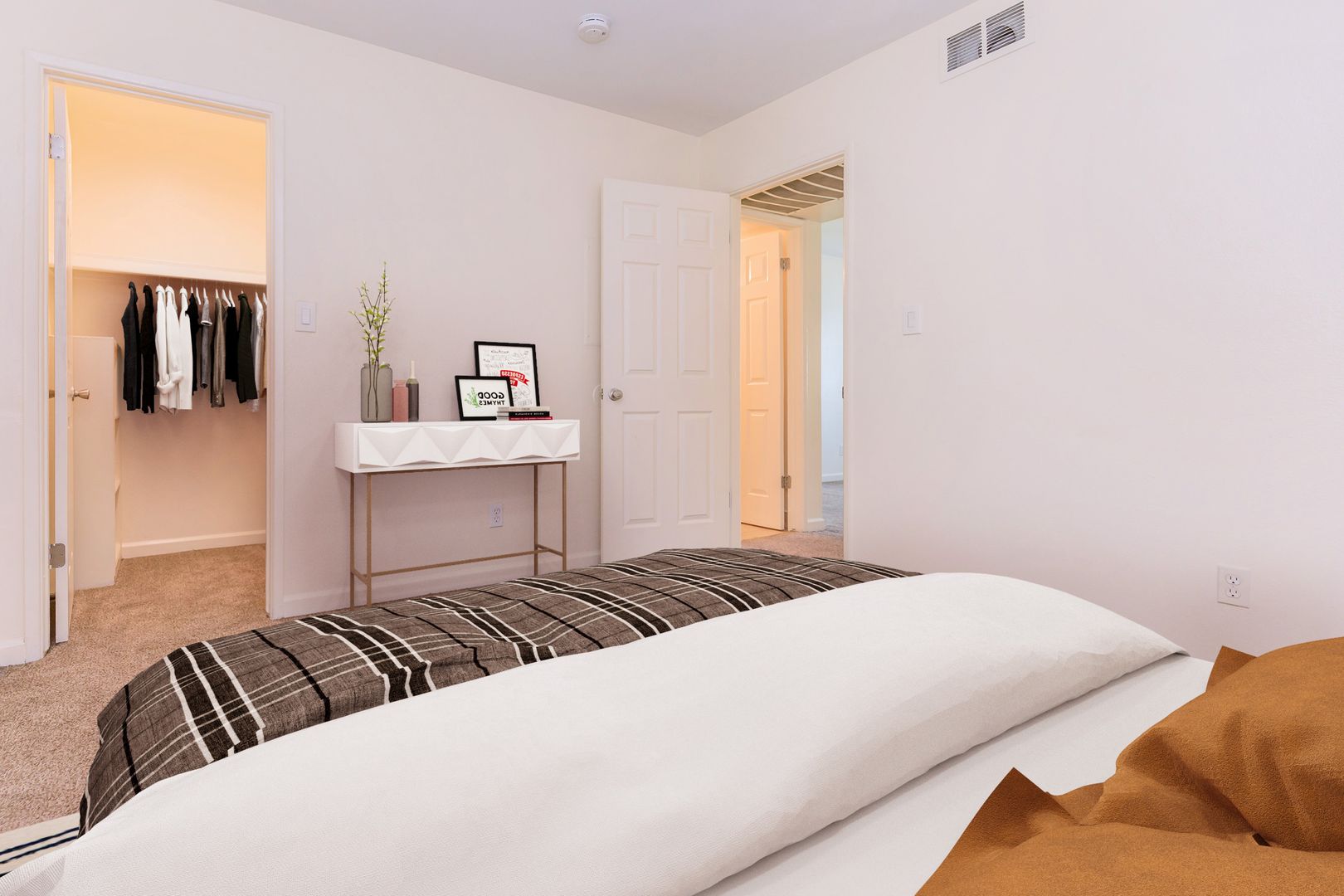 Furnished bedroom shown — representative home at Lynnwood Apartments.