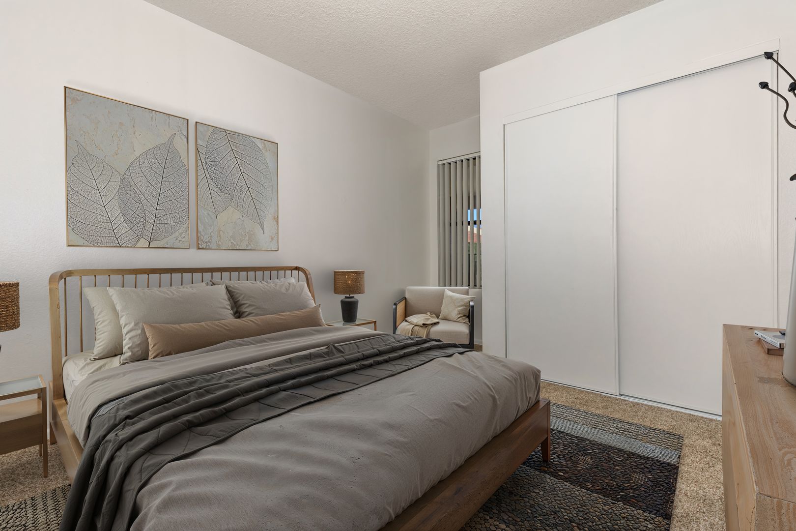 Furnished bedroom shown — representative home at Lynnwood Apartments.