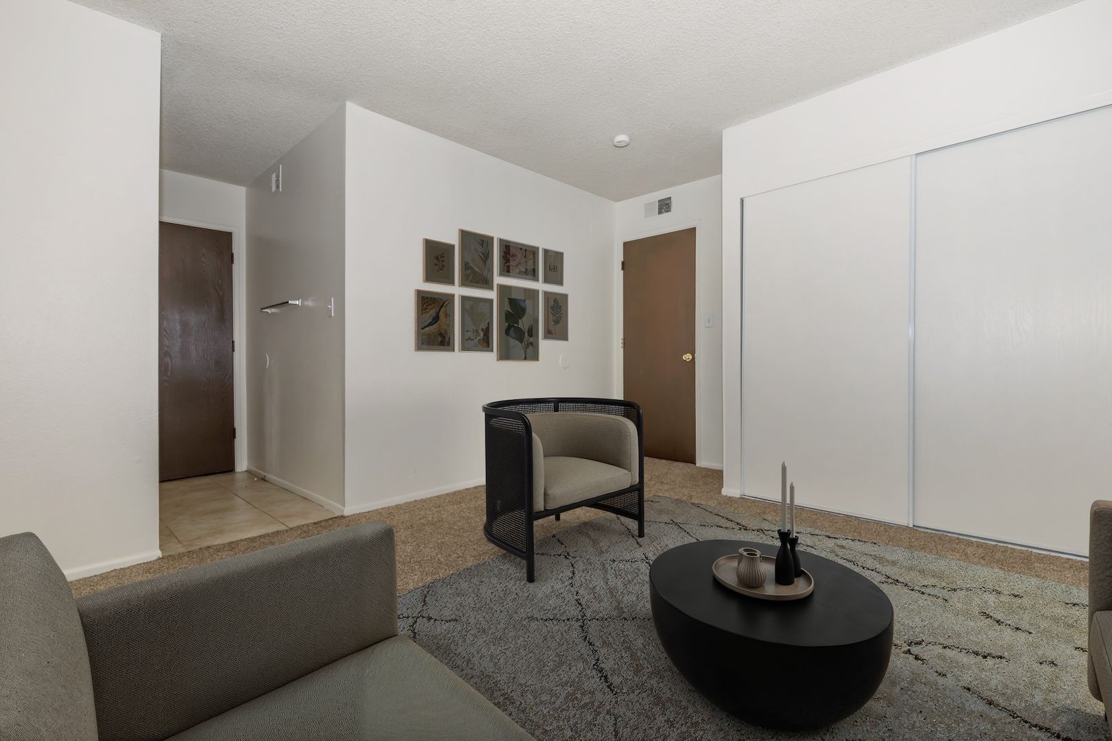 Furnished apartment living area shown — representative home at Lynnwood Apartments.