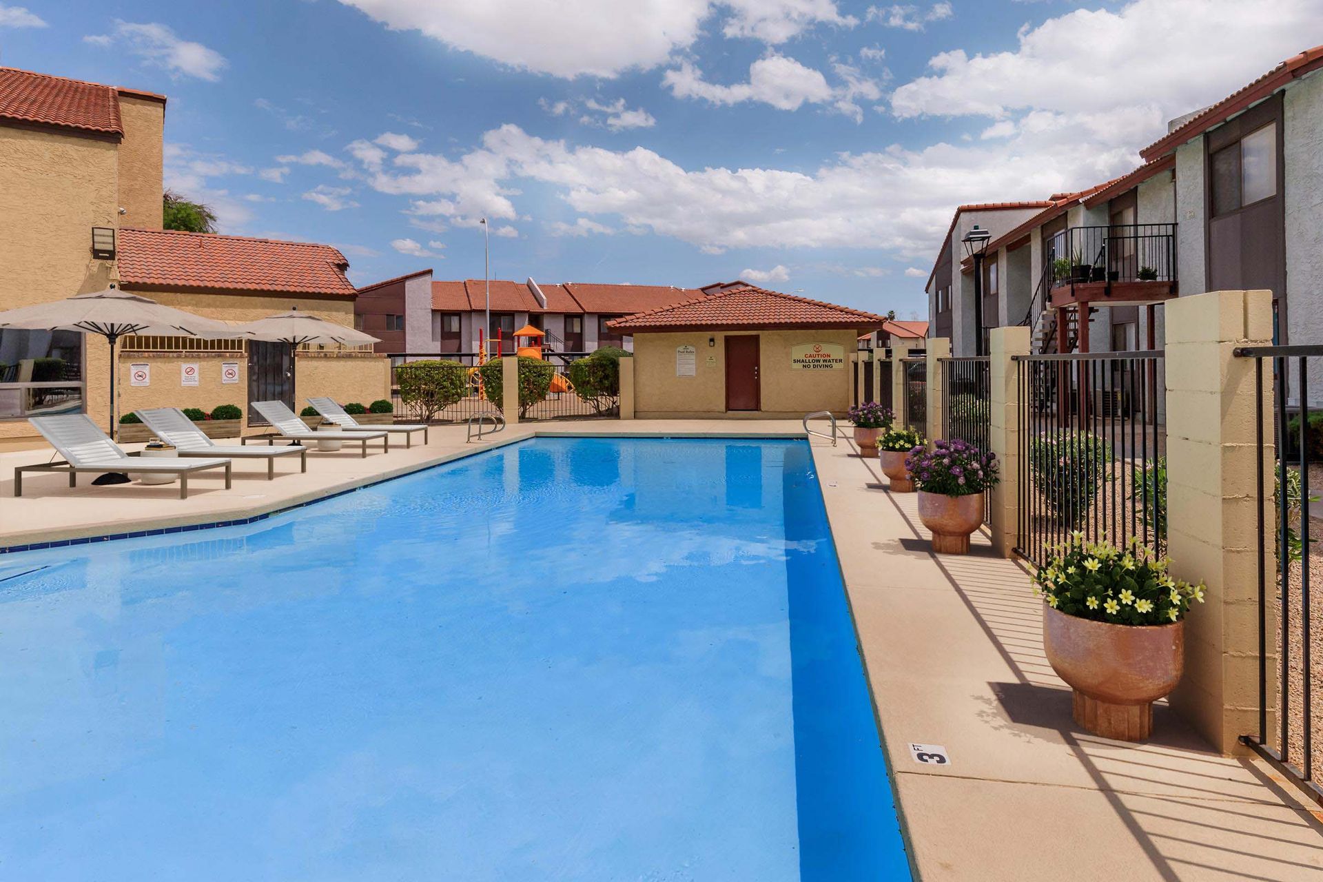 Pool and poolside area at Lynnwood Apartments.