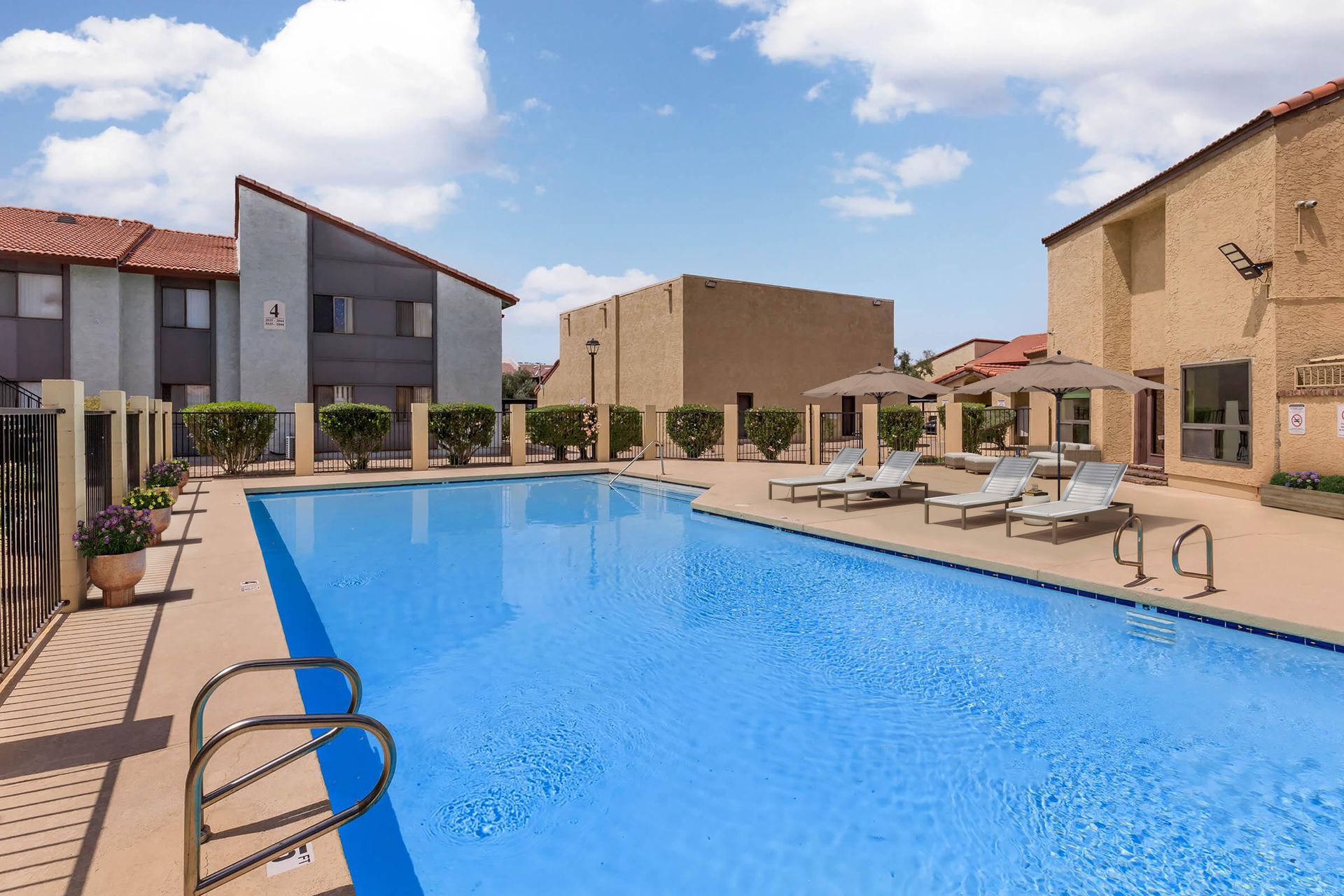 Pool and poolside area at Lynnwood Apartments.