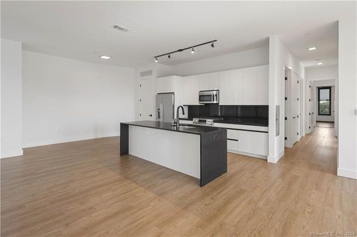 Unit #207 is a beautifully appointed 1,516-square-foot, 2-bedroom, 2-full-bath residence with Soaring 9+ foot ceilings!