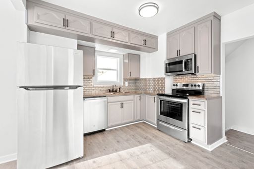 TOTALLY RENOVATED LINCOLN PLACE 4 BEDROOM HOUSE WITH A 2 CAR DETACHED GARAGE!!! – photo 1