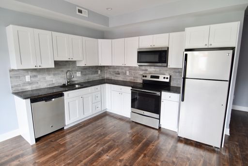 New Construction! Bi-Level two bedroom with a Roof Deck!! Great view. W/D. – photo 1