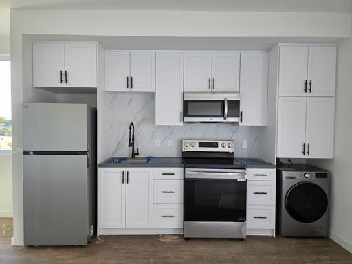 Brand-New Premium 1-Bedroom with Expansive Designer Kitchen & Private Balcony — The Junction (Unit 310) – photo 1