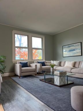 Bright two-bedroom apartment with large yard and extra storage space.