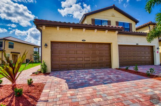 Annual Unfurnished Rental – Coach Home 3 Bedrooms, 2 Baths, 2 Car Garage, with Resort Like Amenities – Gran Paradiso Community! – photo 1