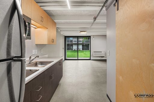 MODERNIZED SECOND FLOOR STUDIO WITH VAULTED CEILINGS AND PATIO – photo 1