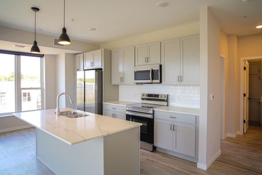 BRIGHT CORNER TWO BEDROOM UNIT WITH PATIO - UNIT I – photo 1