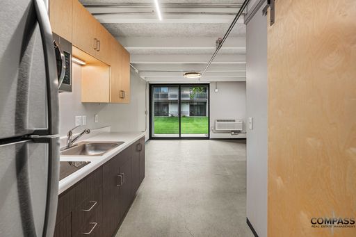 MODERNIZED SECOND FLOOR STUDIO WITH VAULTED CEILINGS AND PATIO – photo 1