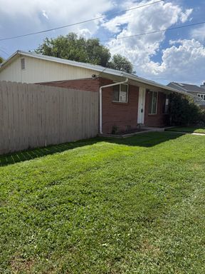 2 bed 1 bath duplex with private and fenced yard, washer/dryer hookups, covered parking, and storage unit – photo 1