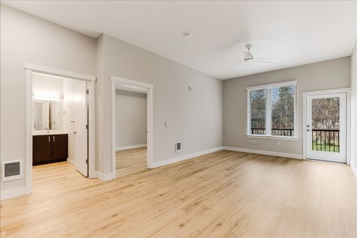 1-Bedroom with open layout and stainless steel appliances – photo 1