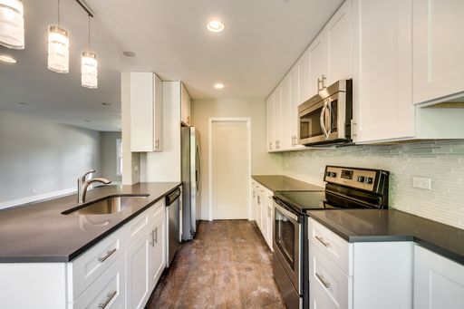 ENTIRELY RENOVATED + RARELY AVAILABLE TOWNHOME FOR RENT