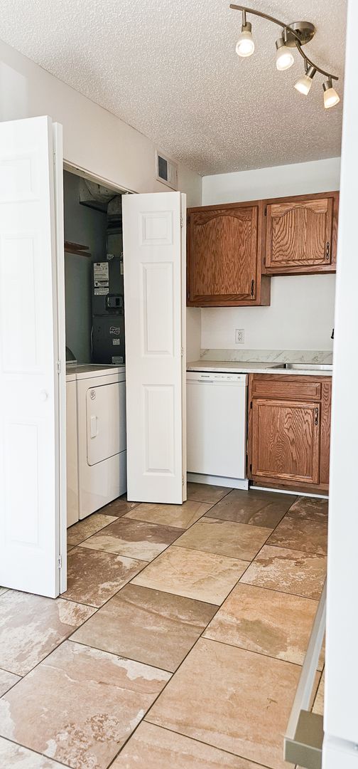 Laundry room at ***Hot Fall Special- Deposit moves you in! No rent until October 15th. *** Beautifully updated 4 Bedroom/2 Bathroom downstairs apartment (3 of 3)