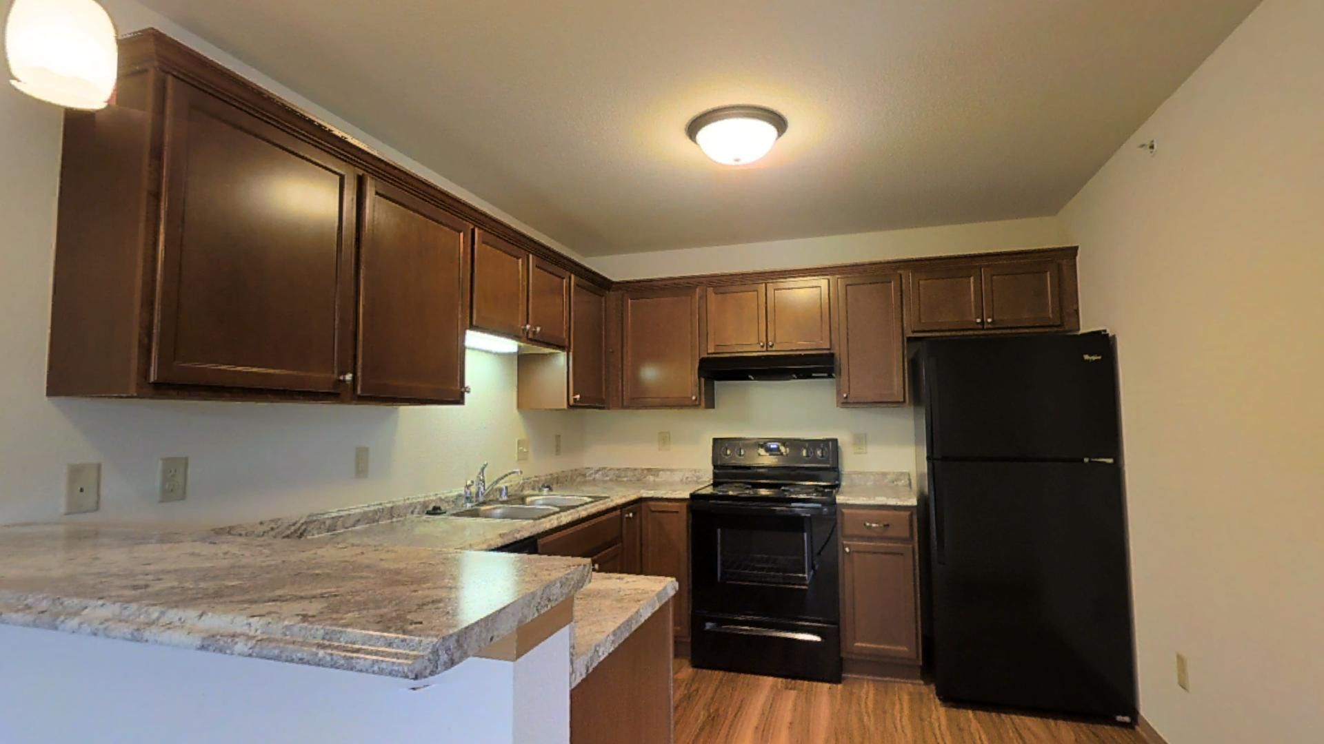 Slinger Apartment: 605,615,625 Cedar Bluffs Way