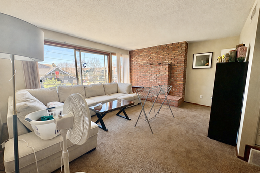 Spacious 1BR Retreat with Balcony & Classic Brick Charm – photo 1