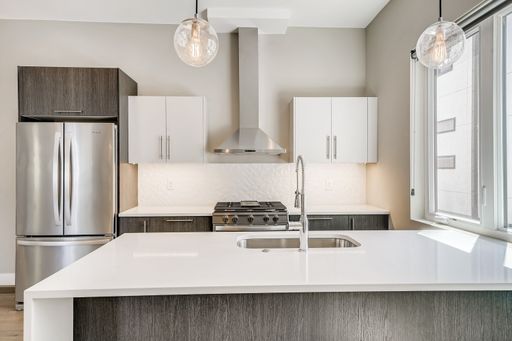 Modern 3-Bedroom Townhome with Rooftop Patio & 2-Car Garage at Fairfax Row – photo 1
