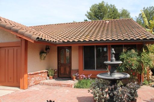 This incredible 4 bedroom single level home with private GATE entry