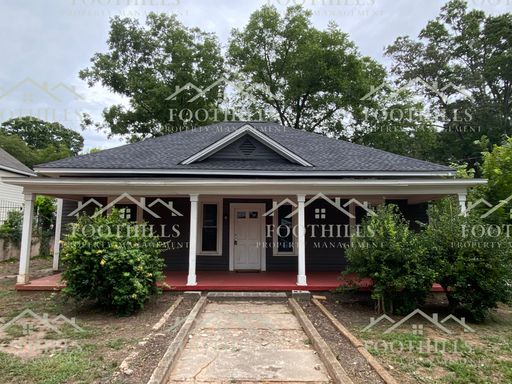 3BR/1BA Home with Hardwood Floors, Front Porch & On-Street Parking – photo 1