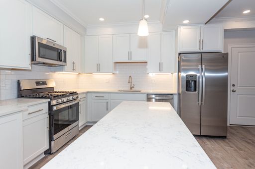 No Broker Fee | Renovated 4 Bed, 2 Bath with In-Unit Laundry & Parking – photo 1