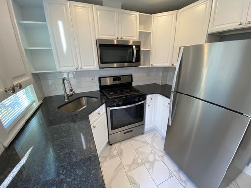 Fully Renovated 2-Bedroom Home for Rent in Cobbs Creek! – photo 1