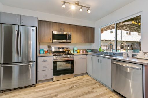 Modern Spanish-style apartments near the Orange Line and Balboa Park | Pool | Pet Friendly – photo 1