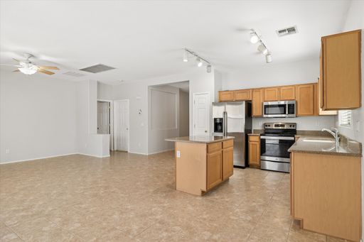 Great 3 bedroom split floor plan in Rogers Ranch, 2 car garage, Tile except in Bedrooms!!! All appliances with pantry, Island and good storage!!! Available NOW!!!